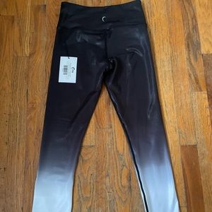 2 pair of Zyia leggings. Each size 4 and stretchy material